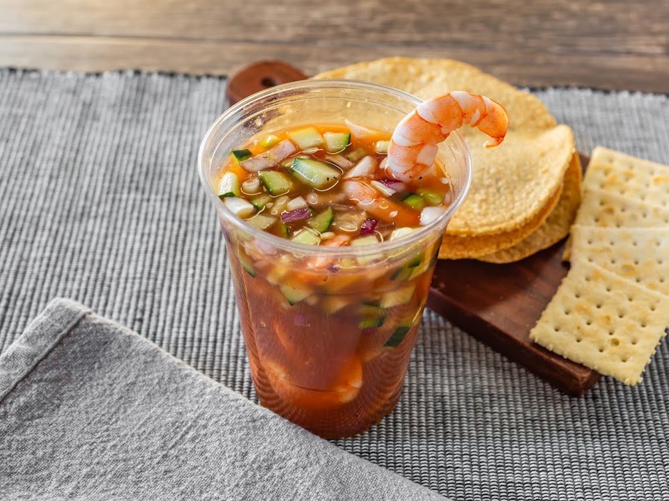 Menu page showing empanadas and shrimp dishes.