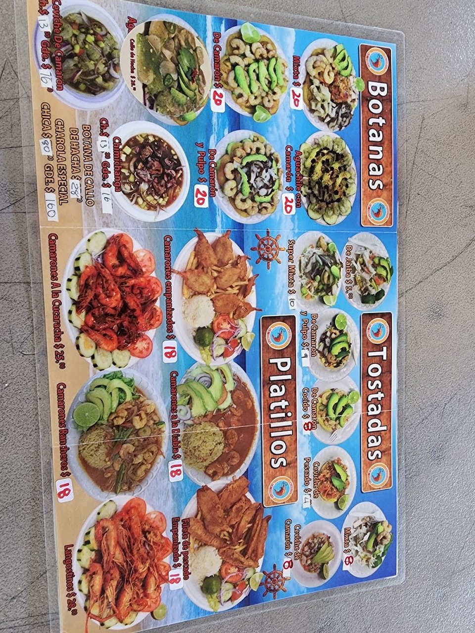 Printed menu with seafood categories and specials.